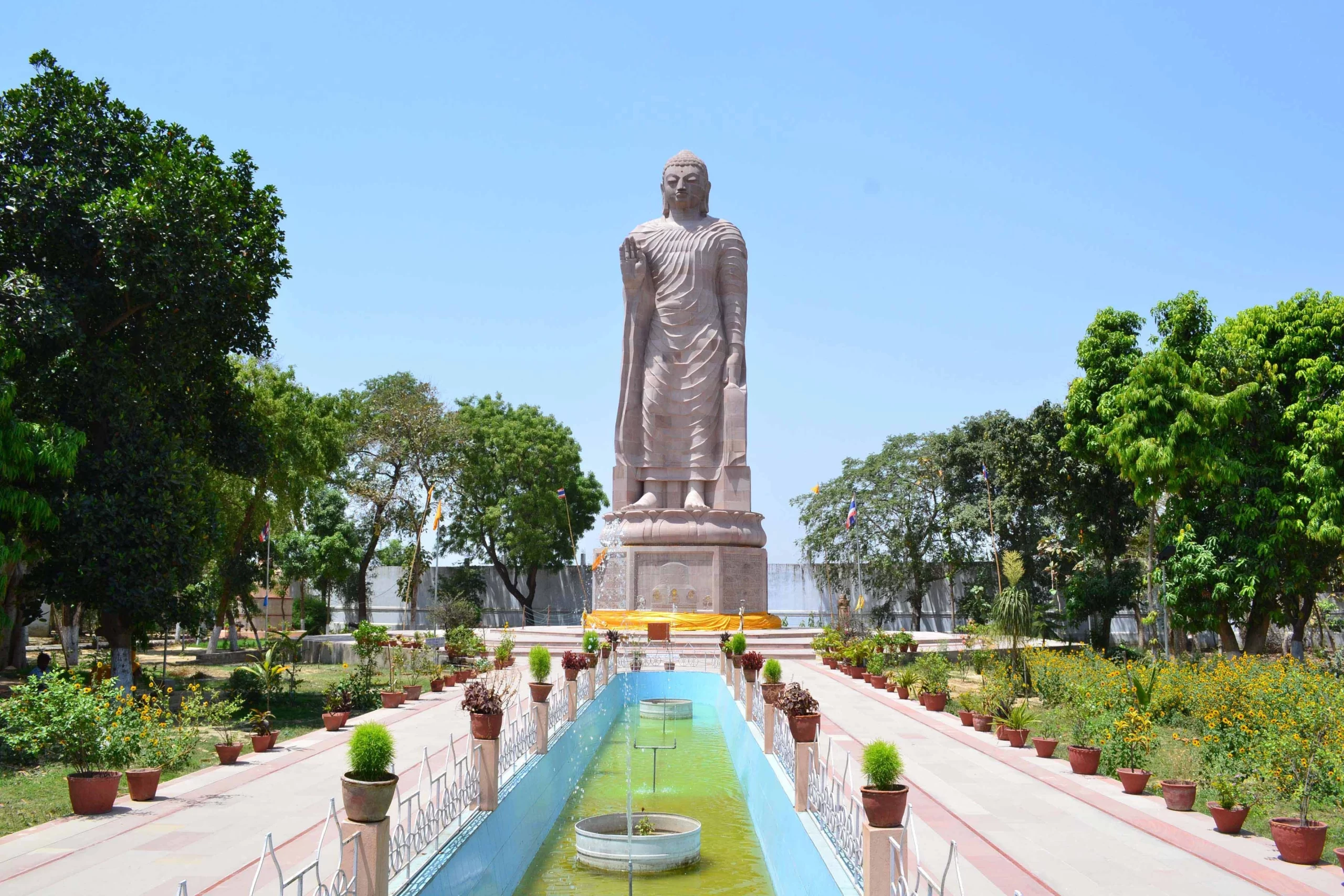 Tranquil Deer Park in Sarnath, where Buddha delivered his first sermon, surrounded by lush greenery and serene atmosphere, perfect for meditation and contemplation.