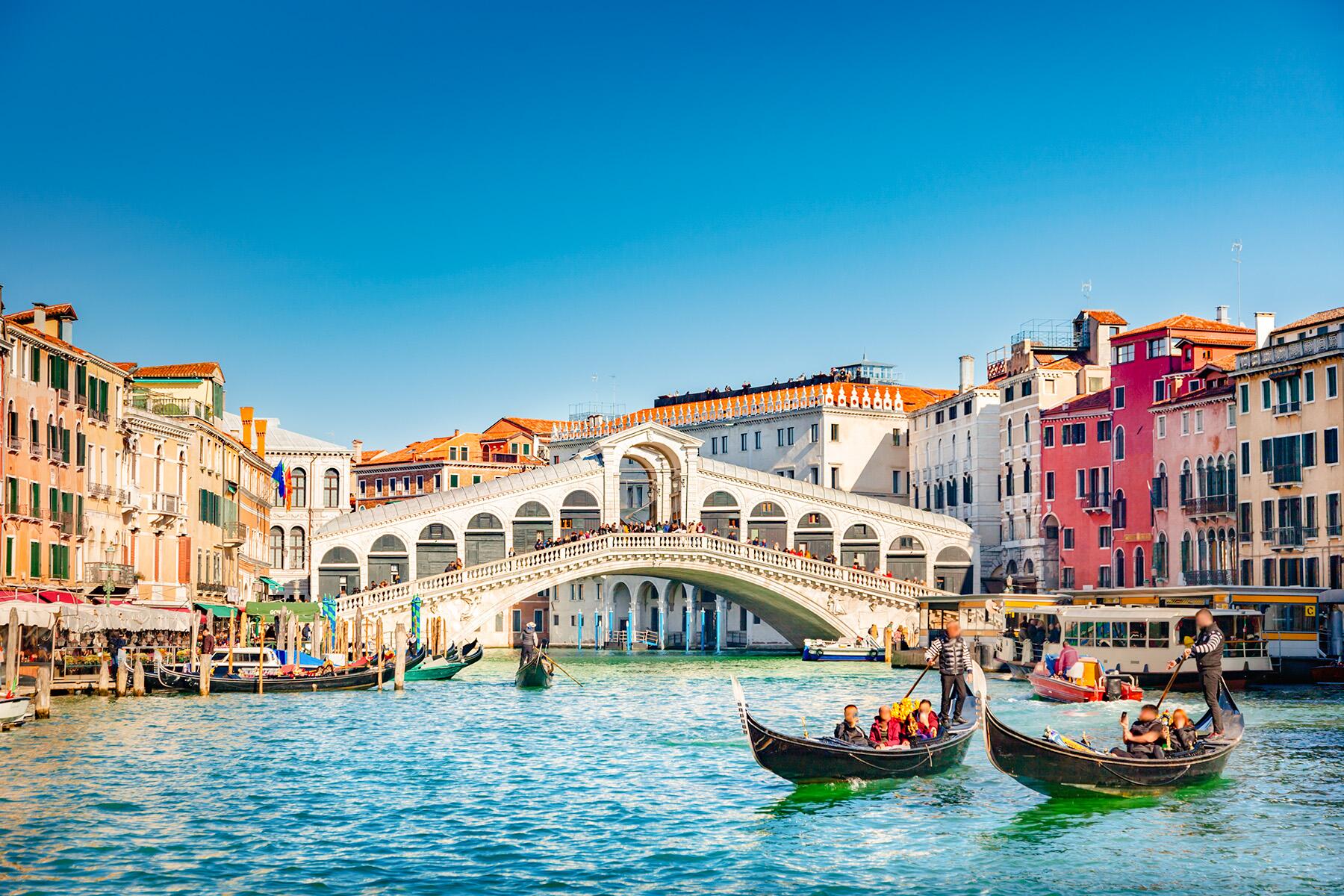 Gondolas gliding through the canals of Venice, Italy