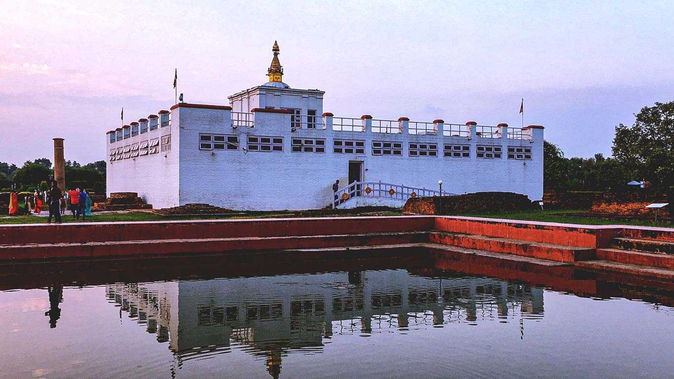 Ashokan Pillar standing tall in Lumbini, a historical landmark.