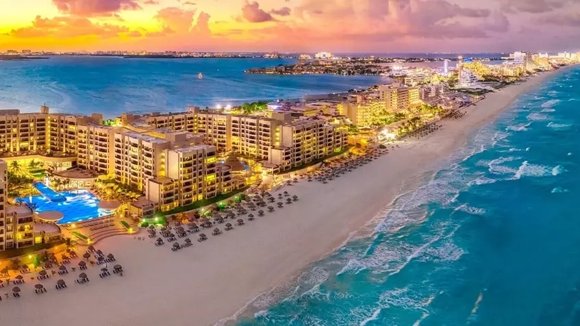 Visitors exploring the ancient Mayan ruins of El Rey in Cancun