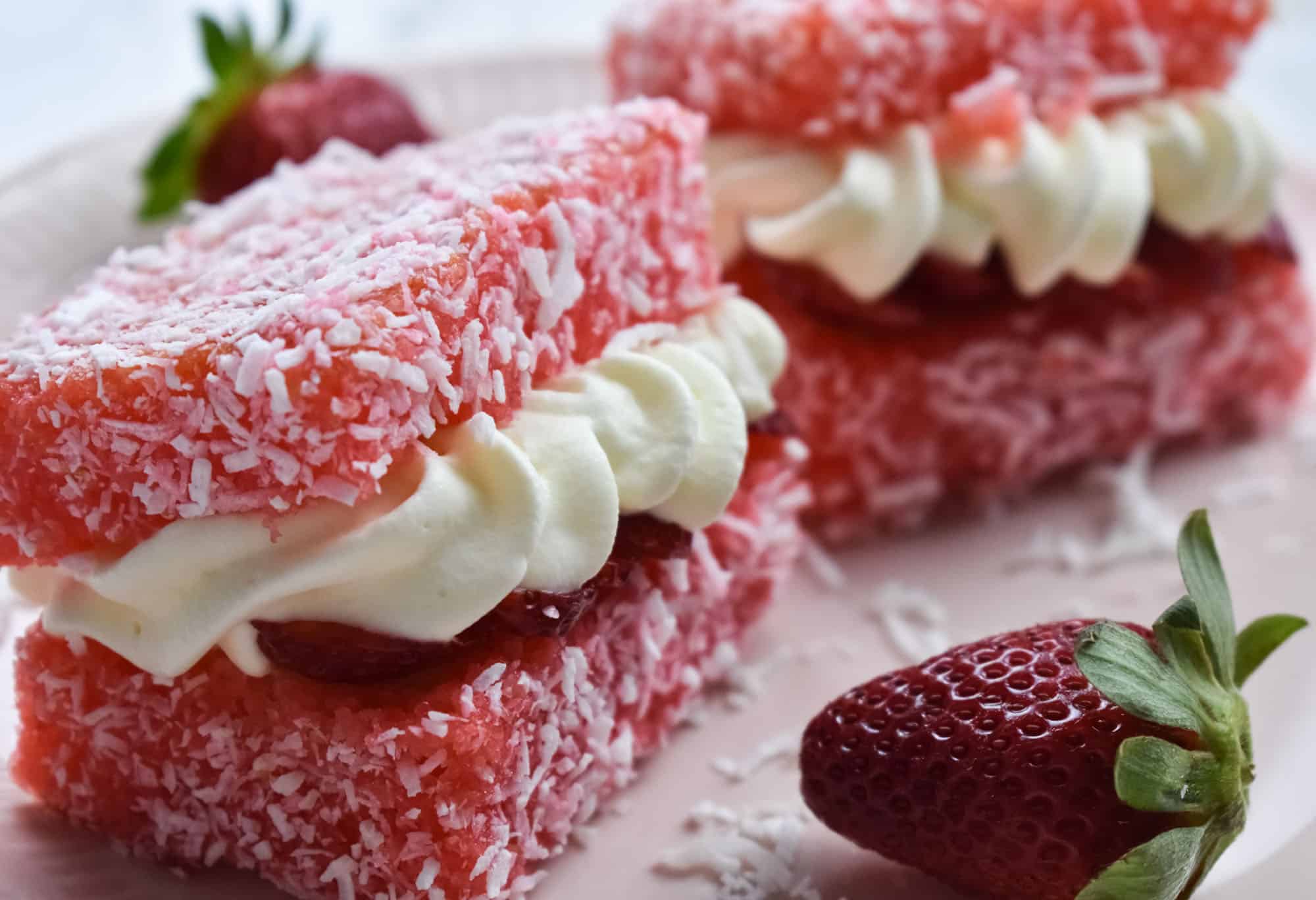 Traditional Lamingtons served with a cup of tea.