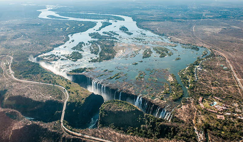 Aerial view of the Zambezi River winding through lush landscapes in Zambia.