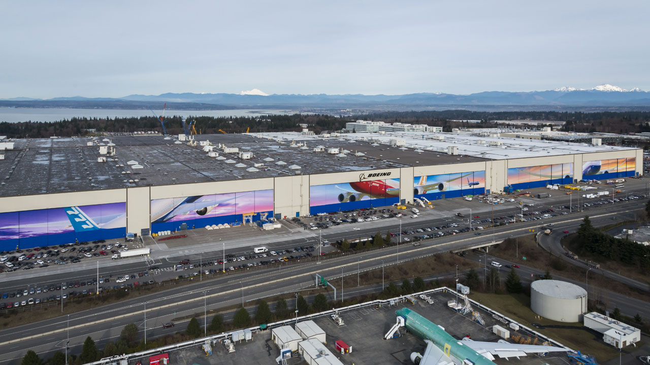 Workers at Boeing Everett Factory inspecting aircraft parts