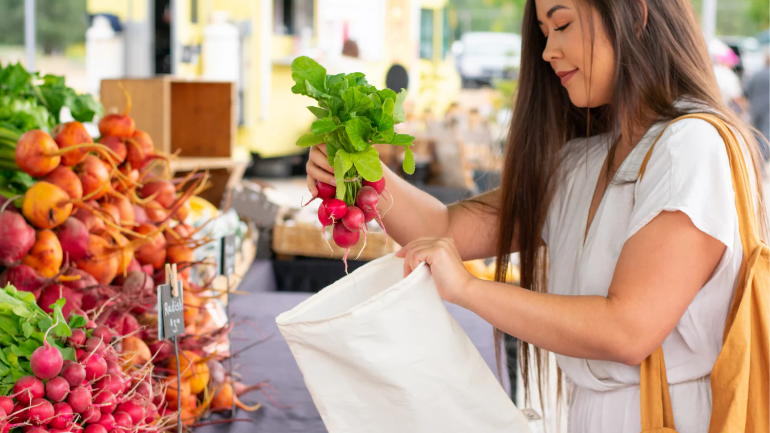 Reusable shopping bag filled with groceries to promote reducing plastic waste