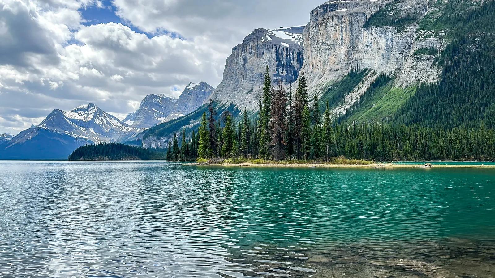 Hikers exploring a scenic trail with mountain views in Jasper National Park 