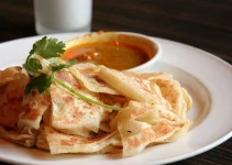 Roti Canai: Malaysia’s Flaky Flatbread Phenomenon 🥞🔥